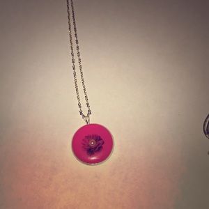 Pink flower with pearl necklace